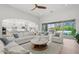 Spacious living room with backyard access, featuring recessed lighting and a ceiling fan at 10778 N 137Th St, Scottsdale, AZ 85259