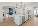 Open-concept kitchen and living space with modern design and lots of natural light at 10778 N 137Th St, Scottsdale, AZ 85259