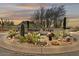 Whisper Ridge community entrance sign amidst desert landscaping, creating a welcoming desert landscape at 10778 N 137Th St, Scottsdale, AZ 85259