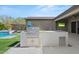 Outdoor kitchen featuring built-in grill, countertop space, and convenient storage at 10778 N 137Th St, Scottsdale, AZ 85259