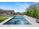 A stunning pool and spa with lush landscaping and outdoor seating, perfect for entertaining at 10778 N 137Th St, Scottsdale, AZ 85259