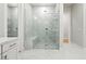Elegant glass enclosed walk-in shower with rain shower head and marble tile at 10778 N 137Th St, Scottsdale, AZ 85259