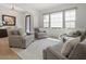 Cozy sitting area with large windows, a crystal chandelier, and comfortable armchairs at 10778 N 137Th St, Scottsdale, AZ 85259
