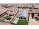 Aerial view of the home showing a backyard with a patio and artificial grass at 13511 W Cassia Trl, Peoria, AZ 85383
