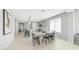 Open-concept kitchen and dining area featuring modern finishes, stainless appliances, and stylish decor at 13511 W Cassia Trl, Peoria, AZ 85383