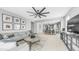 Spacious living room with neutral decor, a comfortable sectional sofa, and an open layout at 13511 W Cassia Trl, Peoria, AZ 85383