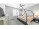 Cozy main bedroom featuring a canopy bed, soft lighting, and neutral decor at 13511 W Cassia Trl, Peoria, AZ 85383