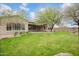 Expansive backyard with lush green lawn and mature trees, perfect for outdoor activities at 1608 W Calle De Pompas --, Phoenix, AZ 85085