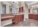 Open bathroom featuring dual vanities, archways, granite counters, and decorative tile at 1608 W Calle De Pompas --, Phoenix, AZ 85085