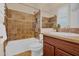 Bathroom featuring tiled shower over tub, wood vanity and framed mirror at 1608 W Calle De Pompas --, Phoenix, AZ 85085