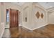 Inviting foyer with decorative tile flooring, high ceilings, and a grand entrance door at 1608 W Calle De Pompas --, Phoenix, AZ 85085