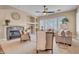 Bright living room with a cozy fireplace, comfortable seating, and ample natural light at 1608 W Calle De Pompas --, Phoenix, AZ 85085