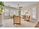 Inviting living room features neutral tones, a ceiling fan, and bright windows with views at 1608 W Calle De Pompas --, Phoenix, AZ 85085