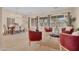 Bright and airy living room with comfortable seating, a dining area, and natural light from large windows at 1608 W Calle De Pompas --, Phoenix, AZ 85085