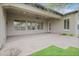Covered patio with brick flooring and ample space for outdoor seating and entertaining at 1608 W Calle De Pompas --, Phoenix, AZ 85085