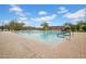 Large community pool with plenty of lounge chairs and umbrellas for relaxing poolside at 1608 W Calle De Pompas --, Phoenix, AZ 85085