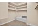 Spacious walk-in closet with built-in shelves and ample storage space at 1608 W Calle De Pompas --, Phoenix, AZ 85085