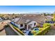 Aerial view of a home with a pool, patio, and solar panels in a well-maintained neighborhood at 17704 W Tasha Dr, Surprise, AZ 85388