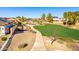 Community park featuring walking paths, grassy area, and mature trees, great for outdoor activities at 17704 W Tasha Dr, Surprise, AZ 85388