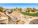 Charming home featuring solar panels, a two-car garage, and a well-manicured front yard at 17704 W Tasha Dr, Surprise, AZ 85388