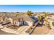 Lovely home with solar panels, two-car garage, white fence, and beautiful landscaping at 17704 W Tasha Dr, Surprise, AZ 85388