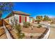 Well-maintained house with desert landscaping, red window shutters, and a white picket fence at 17704 W Tasha Dr, Surprise, AZ 85388