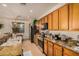 Bright kitchen featuring granite countertops, stainless steel appliances, and light wood cabinetry at 17704 W Tasha Dr, Surprise, AZ 85388