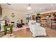 Spacious living room with comfortable seating, open to dining area and featuring tile floors at 17704 W Tasha Dr, Surprise, AZ 85388