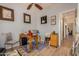 Office space with desk, chair, and view into the hallway at 17704 W Tasha Dr, Surprise, AZ 85388