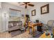 Home office space with comfortable seating and a large window with blinds at 17704 W Tasha Dr, Surprise, AZ 85388
