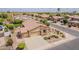 Beautiful aerial view of a home with a tile roof, spacious driveway, and lush landscaping in a quiet neighborhood at 1919 S Granite St, Gilbert, AZ 85295