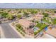 Panoramic aerial view of a home boasting a pristine pool, lush backyard, and charming pergola for outdoor gatherings at 1919 S Granite St, Gilbert, AZ 85295