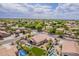 Expansive aerial shot showcases a backyard oasis with a sparkling pool, lush lawn, and inviting outdoor seating at 1919 S Granite St, Gilbert, AZ 85295