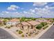 Lovely aerial view of a suburban home with beautiful desert landscaping and a spacious three-car garage at 1919 S Granite St, Gilbert, AZ 85295