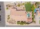 Bird's-eye view captures a backyard with a pool, spa, firepit, putting green, and outdoor seating areas at 1919 S Granite St, Gilbert, AZ 85295