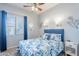Cozy bedroom with a ceiling fan and plush bedding at 1919 S Granite St, Gilbert, AZ 85295