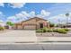 Street view showcasing a spacious home with a three-car garage, desert landscaping, and great curb appeal at 1919 S Granite St, Gilbert, AZ 85295