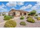 Attractive single-Gathering home showcasing desert landscaping, stone accents, and covered porch at 1919 S Granite St, Gilbert, AZ 85295