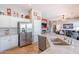 The kitchen showcases stainless steel appliances, granite counters, and a large island with a sink at 1919 S Granite St, Gilbert, AZ 85295