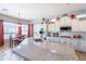 Bright kitchen with large island, modern appliances, and adjacent breakfast nook with backyard views at 1919 S Granite St, Gilbert, AZ 85295