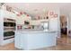 Open concept kitchen with large center island, built-in double ovens, and eat-in bar at 1919 S Granite St, Gilbert, AZ 85295