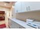 Bright laundry room with sleek white cabinetry and spacious countertop, perfect for household tasks at 1919 S Granite St, Gilbert, AZ 85295