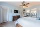 Elegant main bedroom with furniture, TV and view of the en-suite bathroom at 1919 S Granite St, Gilbert, AZ 85295