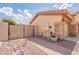 Side yard featuring a privacy gate, stone accents, and convenient access to the home's entrance at 1919 S Granite St, Gilbert, AZ 85295
