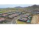 Aerial view highlighting the residential community with mountain views at 20775 W Rattler Rd, Buckeye, AZ 85396