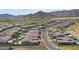 Aerial view showing the neighborhood layout, and mountain views at 20775 W Rattler Rd, Buckeye, AZ 85396