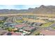 Stunning aerial view of a desert home featuring a private pool and mountain views at 20775 W Rattler Rd, Buckeye, AZ 85396