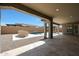 Inviting backyard featuring a pool, outdoor kitchen, and covered patio for entertaining at 20775 W Rattler Rd, Buckeye, AZ 85396