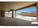 Stunning outdoor covered living space overlooking the pool and landscaped backyard at 20775 W Rattler Rd, Buckeye, AZ 85396