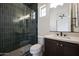 Bathroom with glass enclosed shower and vanity with white counter top at 20775 W Rattler Rd, Buckeye, AZ 85396